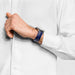 blue caoutchouc rubber watch band worn on man's wrist